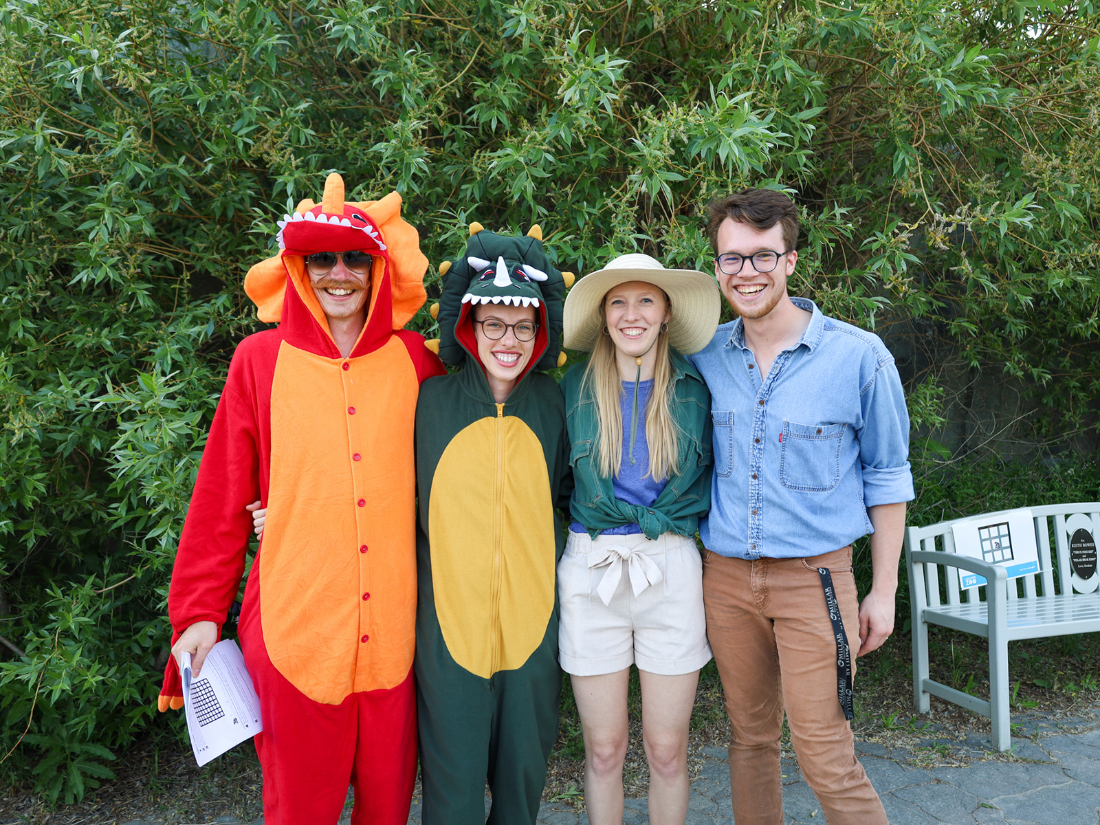 A group of four adults in animal themed costumes smile at the camera at the Locked Zoo event