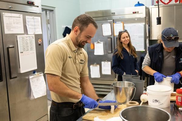 Winnnipeg and Calgary care members working together in the kitchen