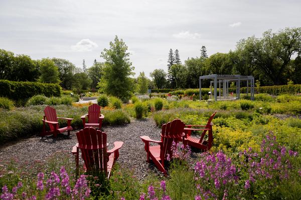 Seasonal Garden, flowers and red chairs