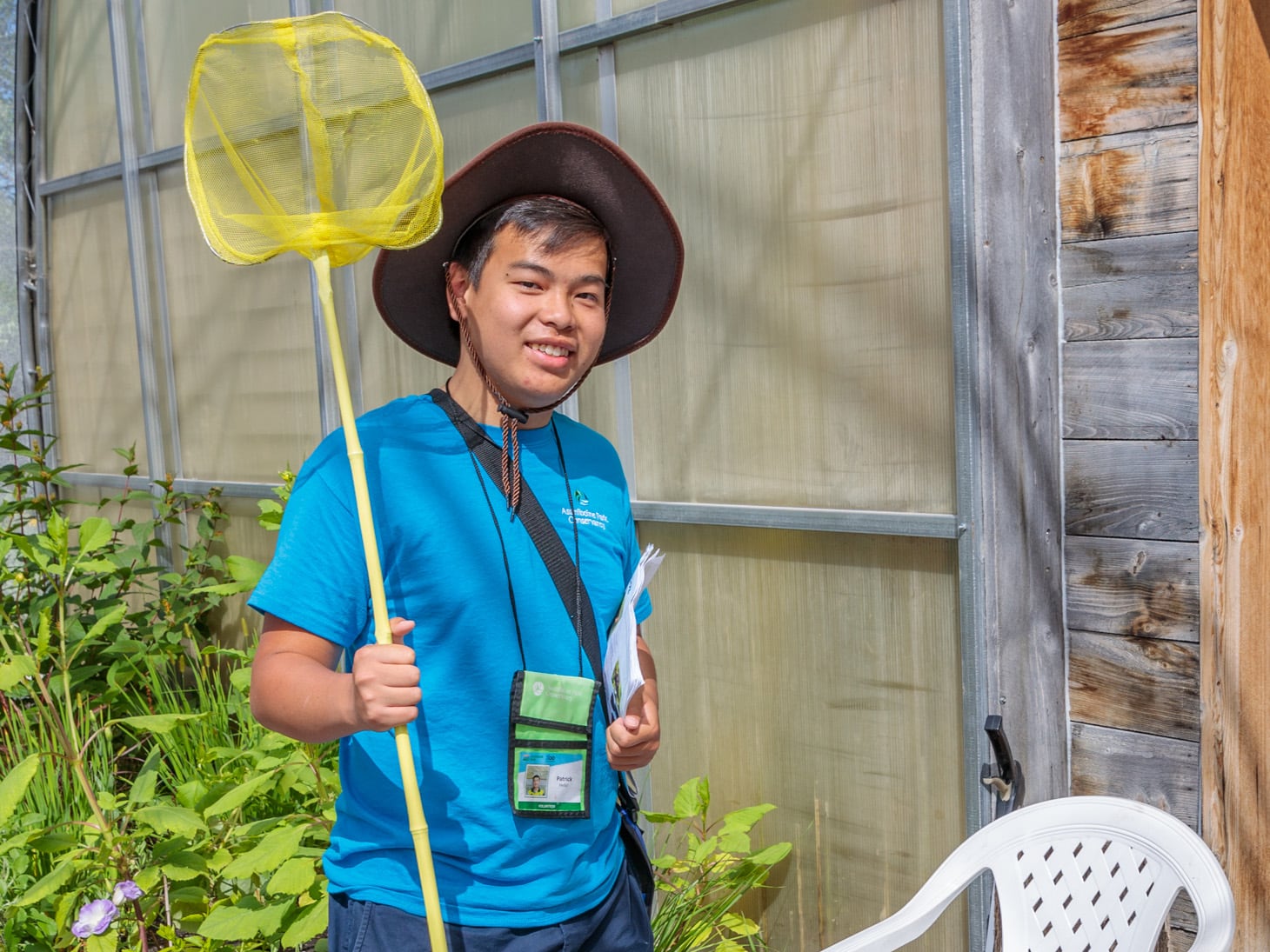 Teen Ambassador poses with a butterfly net
