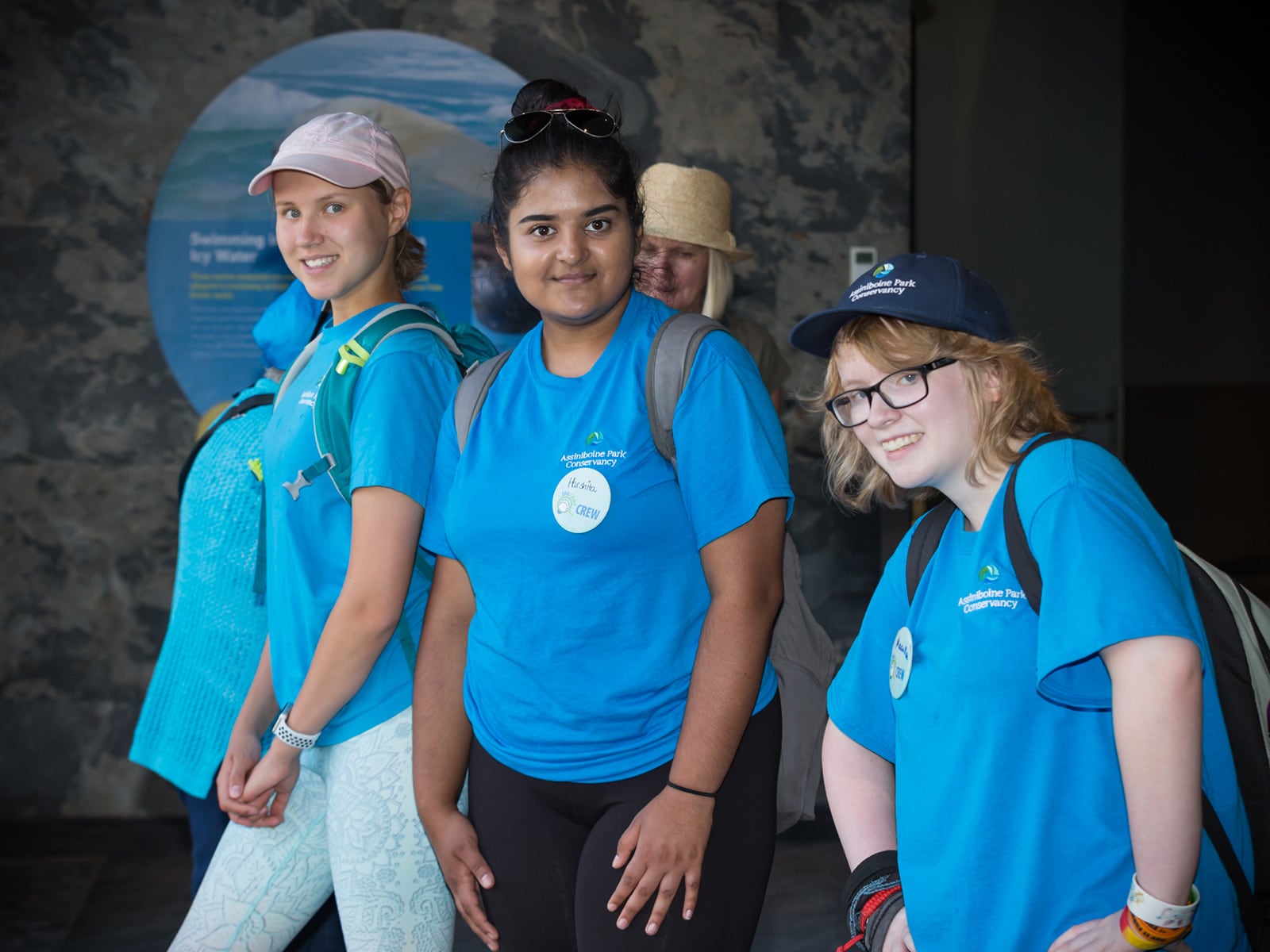 camp volunteers all stand together on a set of stairs outdoors